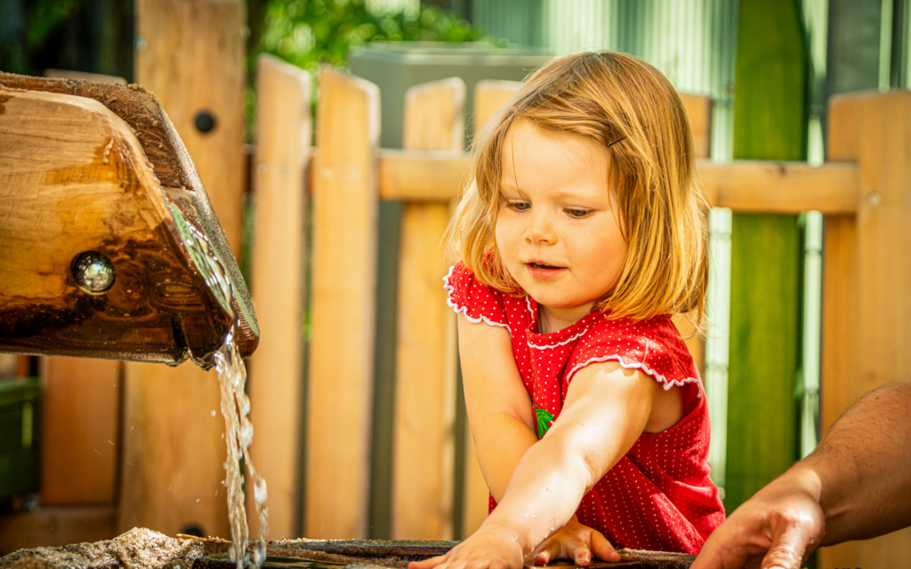 Child playing with water