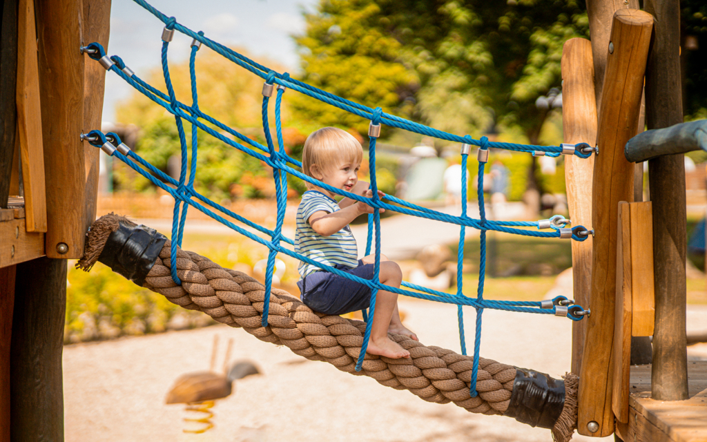 Child on the bridge of a play ship
