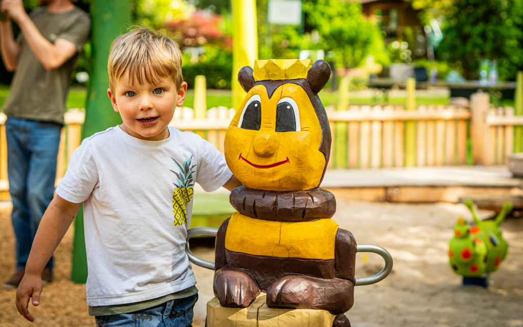 Child with bee carousel